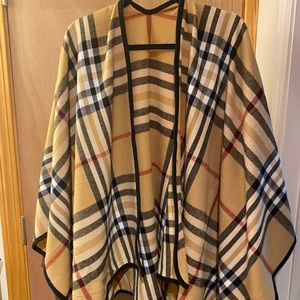 Like new, never worn, blanket wrap, poncho. Stylish plaid print. So soft